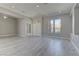 This living room is spacious and bright, featuring light floors, neutral walls, and two closets at 6845 Hidden Sunset Ln, Las Vegas, NV 89120