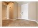 Welcoming entryway with tile flooring, neutral paint, and a white front door at 6929 Homing Pigeon Pl, North Las Vegas, NV 89084