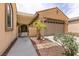Cozy front entrance featuring a pergola, desert landscaping, and tiled walkway at 6929 Homing Pigeon Pl, North Las Vegas, NV 89084
