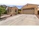 Inviting single-story home with desert landscaping and a spacious two car driveway at 6929 Homing Pigeon Pl, North Las Vegas, NV 89084
