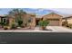 Charming single-story home with a well-maintained yard and attached two car garage at 6929 Homing Pigeon Pl, North Las Vegas, NV 89084