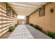 Shaded front porch with a pergola and lush landscaping for added privacy at 6929 Homing Pigeon Pl, North Las Vegas, NV 89084