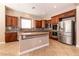 Gourmet kitchen with stainless steel appliances and granite countertops at 6929 Homing Pigeon Pl, North Las Vegas, NV 89084