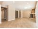 Spacious living room boasts tile flooring, neutral paint, and cozy fireplace at 6929 Homing Pigeon Pl, North Las Vegas, NV 89084