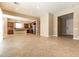 Open concept living room featuring neutral colors, tile flooring and lots of natural light at 6929 Homing Pigeon Pl, North Las Vegas, NV 89084