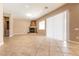 Open living room featuring tile flooring, a fireplace, and sliding glass door at 6929 Homing Pigeon Pl, North Las Vegas, NV 89084