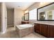 Luxurious primary bathroom with a soaking tub, dual vanities and lots of natural light at 6929 Homing Pigeon Pl, North Las Vegas, NV 89084