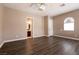 Large main bedroom with wood-look flooring and an ensuite bathroom for added convenience at 6929 Homing Pigeon Pl, North Las Vegas, NV 89084