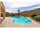 A kidney-shaped pool with a built-in spa and lush landscaping offers a relaxing outdoor oasis at 6929 Homing Pigeon Pl, North Las Vegas, NV 89084
