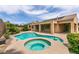 An in-ground pool and spa in the backyard are perfect for entertaining and relaxing at 6929 Homing Pigeon Pl, North Las Vegas, NV 89084