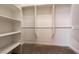 Spacious walk-in closet featuring built-in shelving and ample storage space for organization at 6929 Homing Pigeon Pl, North Las Vegas, NV 89084