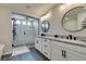 Beautiful bathroom featuring a glass-enclosed shower, a soaking tub, and dual sinks at 7077 Sunland Hills Ave, Las Vegas, NV 89113