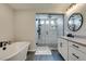 Elegant bathroom with a walk-in shower, dual sinks, and modern finishes at 7077 Sunland Hills Ave, Las Vegas, NV 89113