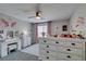 bedroom with charming decor featuring vanity, dressers, and a ceiling fan at 7077 Sunland Hills Ave, Las Vegas, NV 89113