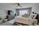 Serene bedroom featuring a plush bed, neutral colors, and an abundance of natural light at 7077 Sunland Hills Ave, Las Vegas, NV 89113