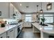 Bright kitchen features a gas cooktop, stainless steel appliances, stylish lighting, and ample counter space at 7077 Sunland Hills Ave, Las Vegas, NV 89113