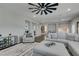 Bright living room featuring wood floors, a large sectional, area rug, and plenty of natural light at 7077 Sunland Hills Ave, Las Vegas, NV 89113