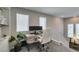 Bright home office space with natural light, featuring a modern desk setup and comfortable seating at 7077 Sunland Hills Ave, Las Vegas, NV 89113