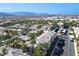 This aerial shows well-manicured community landscaping with tall palm trees and assigned parking at 7143 S Durango Dr # 202, Las Vegas, NV 89113