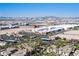 A bird's eye view showing the community with city skyline views in the distance at 7143 S Durango Dr # 202, Las Vegas, NV 89113