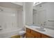 The full bathroom includes a shower-tub combo, single sink, and vanity with a large mirror at 7143 S Durango Dr # 202, Las Vegas, NV 89113