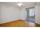 Bright bedroom with sliding glass door and wood-look laminate flooring offers a light and airy retreat at 7143 S Durango Dr # 202, Las Vegas, NV 89113