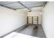 Spacious one-car garage with room for storage shelves, providing secure parking and extra space at 7143 S Durango Dr # 202, Las Vegas, NV 89113