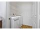 A bright laundry room equipped with a modern, white washer and dryer set for convenient in-home laundry at 7143 S Durango Dr # 202, Las Vegas, NV 89113