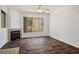 Inviting living room features wood-look floors, a fireplace, and natural light at 7143 S Durango Dr # 202, Las Vegas, NV 89113