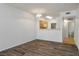 Open-concept living space with a view of the kitchen and modern lighting at 7143 S Durango Dr # 202, Las Vegas, NV 89113