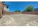Open backyard space featuring a perimeter block wall providing privacy at 7464 Edgecove Ct, Las Vegas, NV 89139