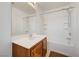 This bathroom offers a combination tub and shower and a vanity with a sink at 7464 Edgecove Ct, Las Vegas, NV 89139