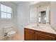 This bathroom offers a vanity with a sink and a toilet at 7464 Edgecove Ct, Las Vegas, NV 89139