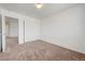 Clean, carpeted bedroom with neutral walls and ample closet space for storage at 7464 Edgecove Ct, Las Vegas, NV 89139