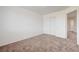 This bedroom offers carpeting and a double door closet at 7464 Edgecove Ct, Las Vegas, NV 89139