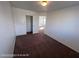 Bedroom featuring plush carpet, closet with sliding doors and natural lighting at 7464 Edgecove Ct, Las Vegas, NV 89139