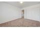 Cozy carpeted bedroom featuring neutral walls, closet, and ample space at 7464 Edgecove Ct, Las Vegas, NV 89139