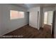 Bright bedroom with window, closet, and neutral color scheme at 7464 Edgecove Ct, Las Vegas, NV 89139