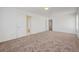 Bright bedroom offers plush carpeting and convenient access to an adjacent room at 7464 Edgecove Ct, Las Vegas, NV 89139