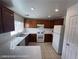 Functional kitchen features wood cabinets and ample counter space at 7464 Edgecove Ct, Las Vegas, NV 89139