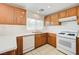 Updated kitchen featuring white countertops, wooden cabinets, and stainless steel appliances, blending style and functionality at 7464 Edgecove Ct, Las Vegas, NV 89139