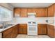 Bright kitchen with a gas stove, stainless steel sink, and ample cabinet space, ideal for cooking and storage at 7464 Edgecove Ct, Las Vegas, NV 89139