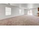 Large, bright living room featuring a ceiling fan and sliding glass doors leading to outdoor space, offering natural light at 7464 Edgecove Ct, Las Vegas, NV 89139