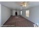 Large living room with a ceiling fan and neutral walls, perfect for relaxation at 7464 Edgecove Ct, Las Vegas, NV 89139