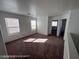 Upstairs loft with neutral carpet and plenty of natural light at 7464 Edgecove Ct, Las Vegas, NV 89139