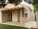 Covered back patio with artificial turf, storage shed, and outdoor fan at 7620 Donald Nelson Ave, Las Vegas, NV 89131
