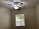 Well-lit bedroom featuring a ceiling fan and window for natural light at 7620 Donald Nelson Ave, Las Vegas, NV 89131