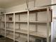 Functional garage with white shelving, providing ample storage space for organizing belongings at 7620 Donald Nelson Ave, Las Vegas, NV 89131