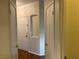 Hallway with wood floors, neutral walls, and doors leading to rooms at 7620 Donald Nelson Ave, Las Vegas, NV 89131