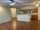 Open concept living area with a kitchen island and hardwood floors at 7620 Donald Nelson Ave, Las Vegas, NV 89131